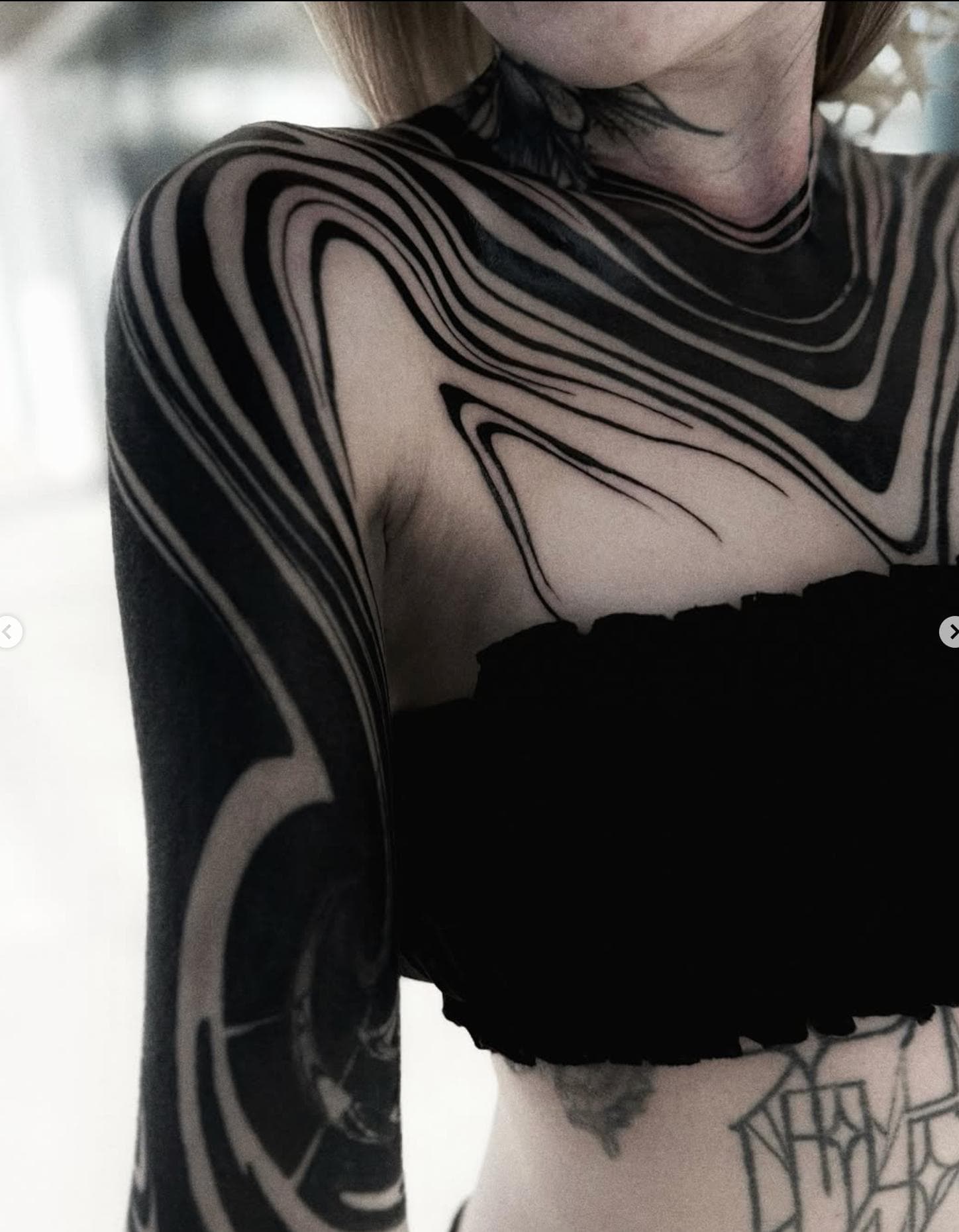 Blackwork abstract full sleeve tattoo on arm and shoulder