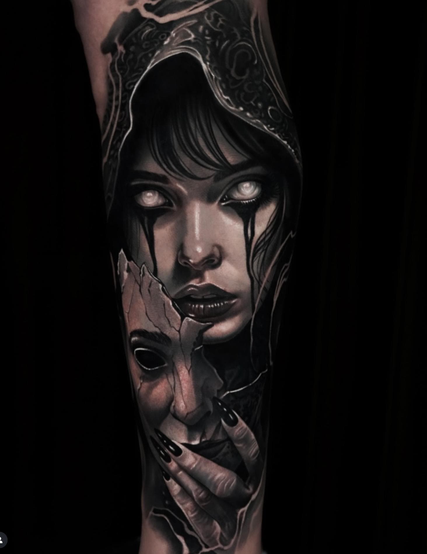 Black and grey realistic horror mask tattoo on forearm