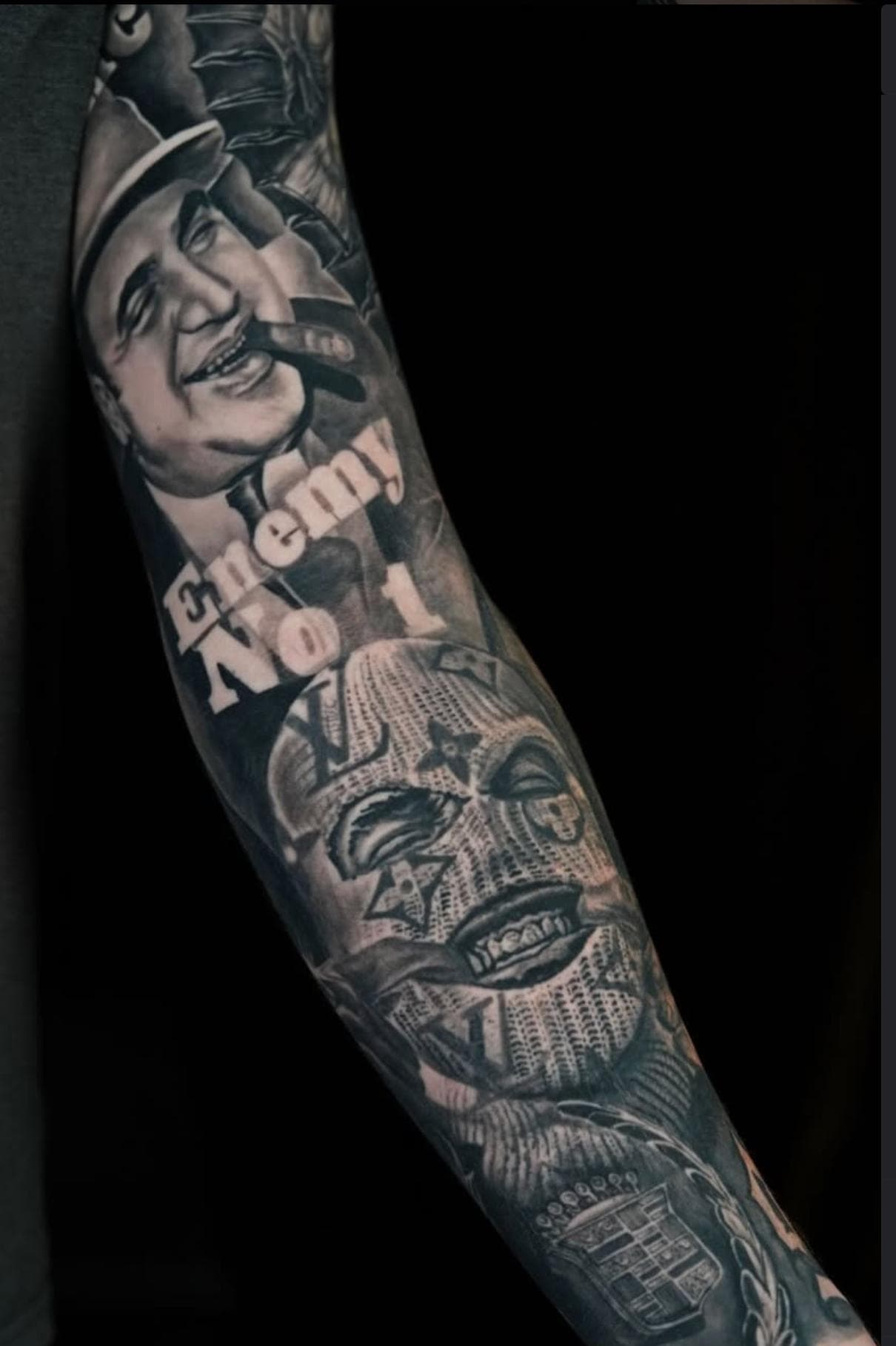 Black and grey Chicano style tattoo on forearm